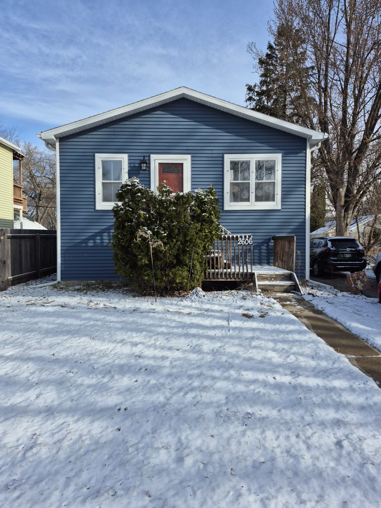 A "before" image of a house with a simple entryway.